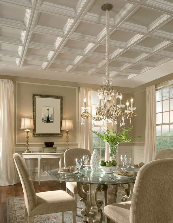Cream colored dining room with white coffered ceiling