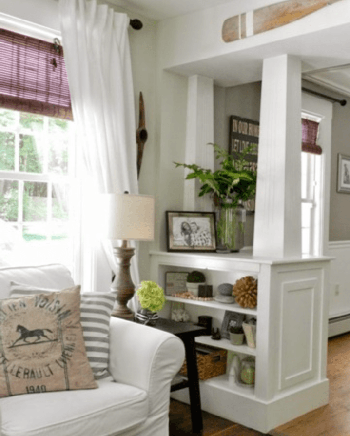 Bre Doucette designed country living room with pony wall bookcase