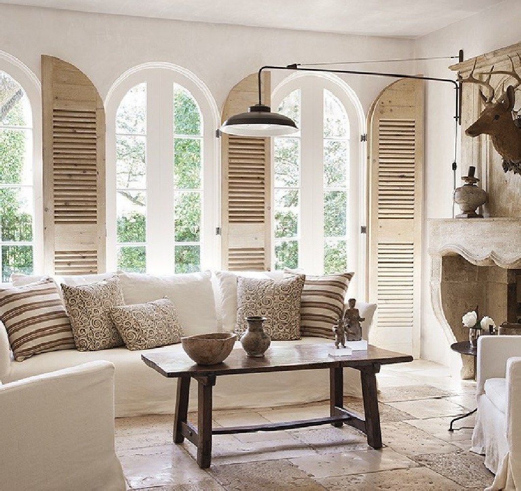 living room with arched windows and shutters by Pamela Pierce's Milieu magazine