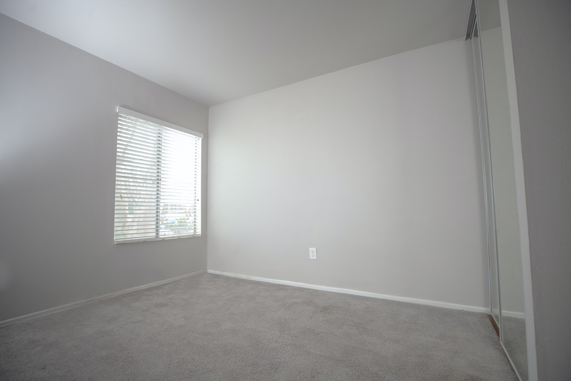 Plain naked room home-interior with blank nude walls and no furnishings