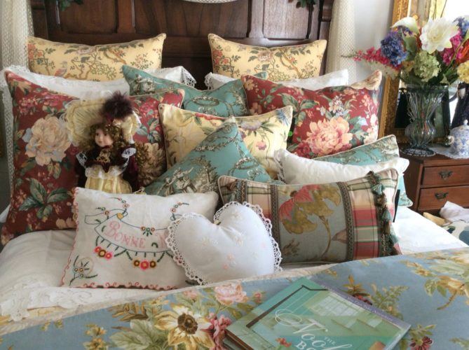 Unknown Author too many pillows on bed Bed with fifteen toss pillows