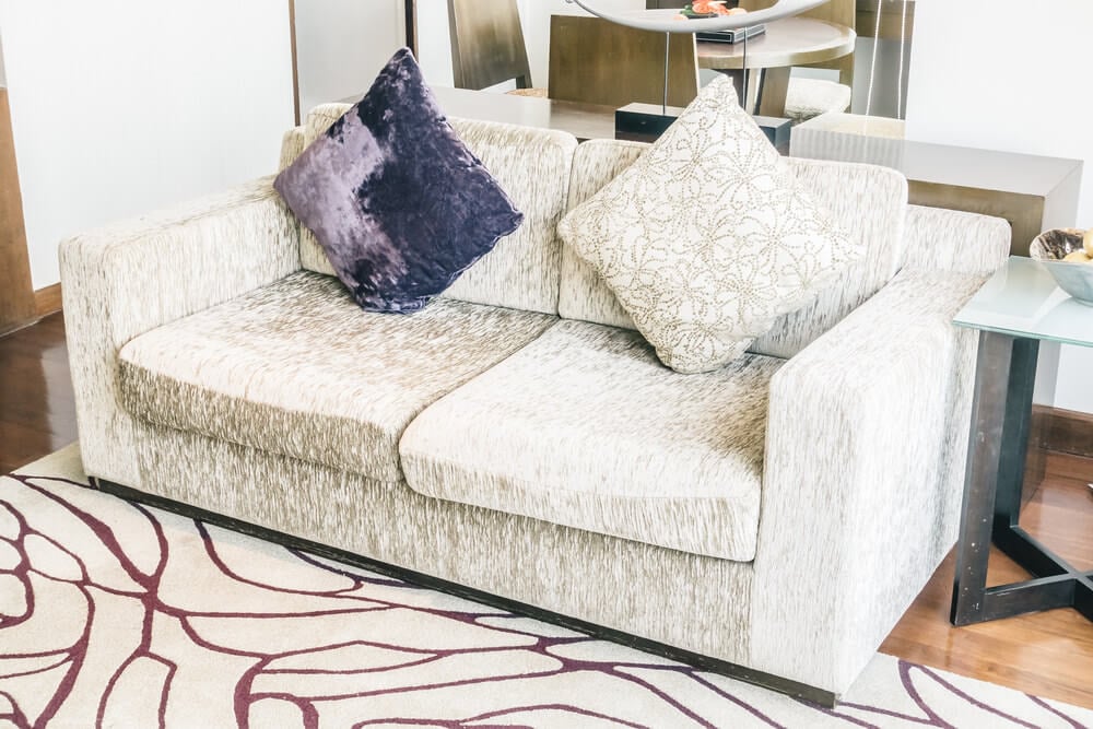 freepik Sofa with two pillows standing on their corners is another throw pillow mistake.