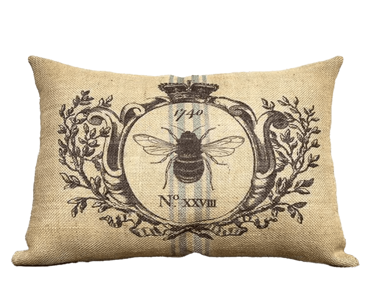 Lumbar pillow with illustrated large bee surrounded by illustrated sprigs