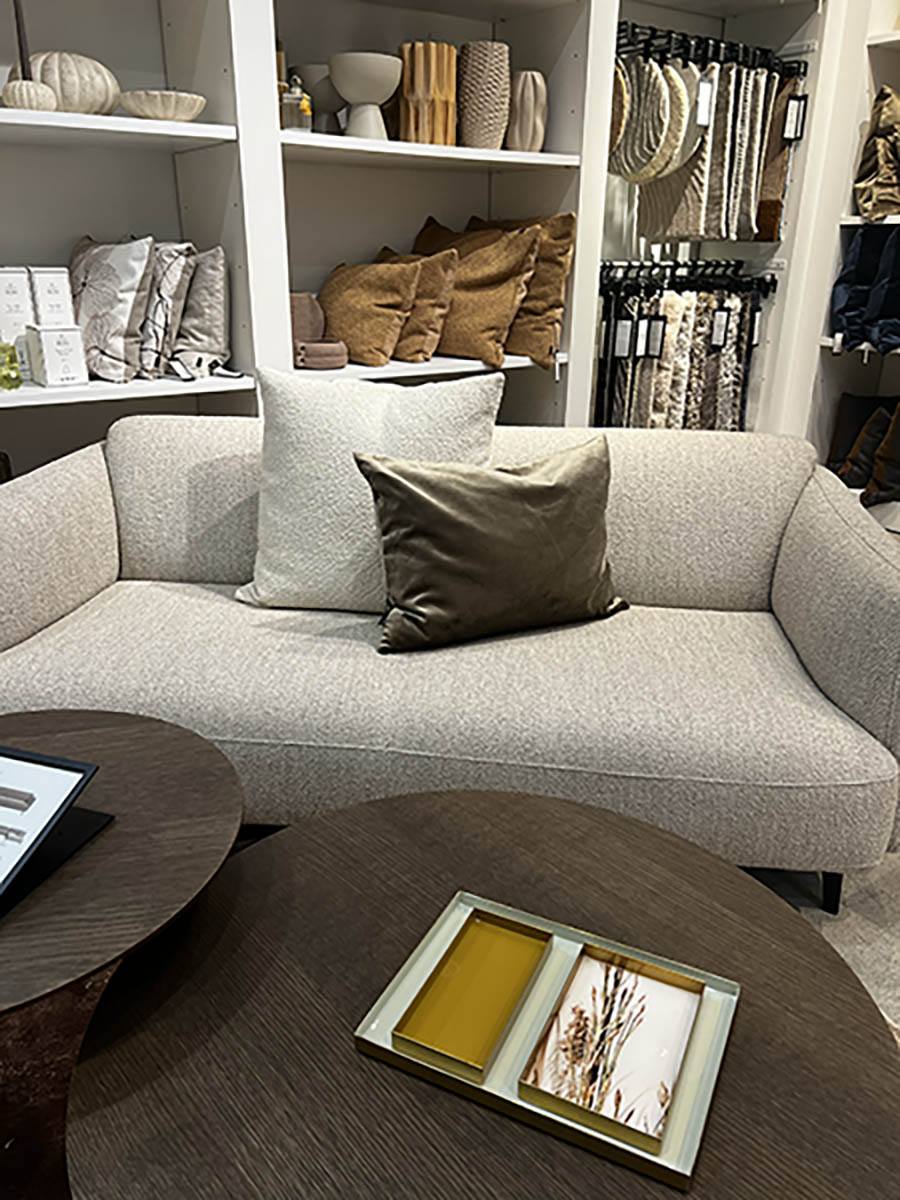 Throw Pillows in Center Link to Michellewinterdesign.com A modern bench sofa from BoConcept with two toss pillows in the center of the sofa.