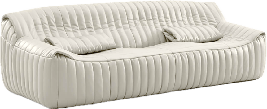 Cream channel-tufted leather sofa with curvy silhouette and two matching pillows